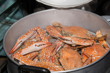 Steamed crabs in the steamer on Hot Smoke Background