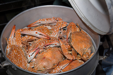Steamed crabs in the steamer on Hot Smoke Background