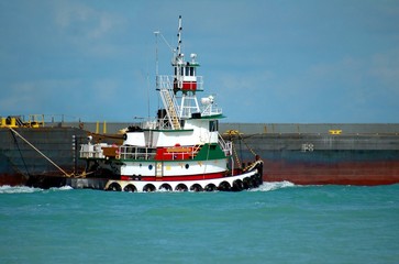 Tug Boat towing a barge