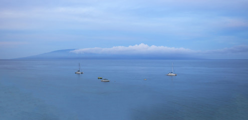 Fototapeta premium Calm Ocean Vast Seascape with Island in Background