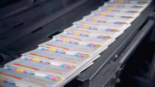Stream of ready-made newspapers on the conveyor.