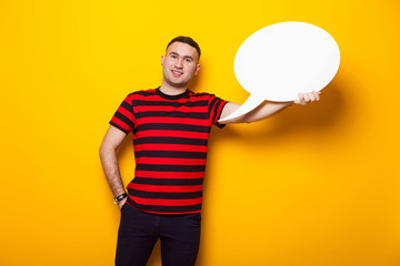 Handsome man in bright T-shirt with speech bubble