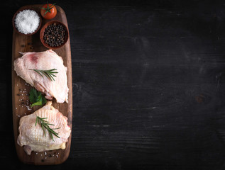 Obraz na płótnie Canvas Served raw chicken meat on the table with blank space
