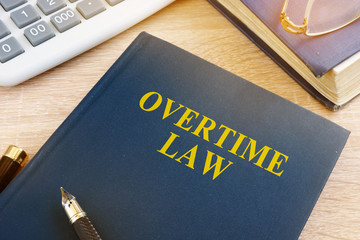Overtime law and calculator in an office.