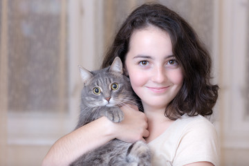 Portrait of a girl with a cat