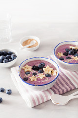 healthy berry smoothie bowl with banana and sesame seed