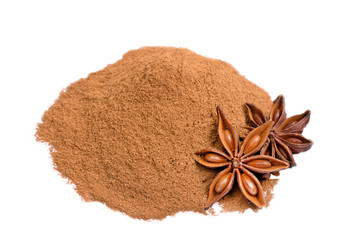 Cinnamon powder and star anise on white background