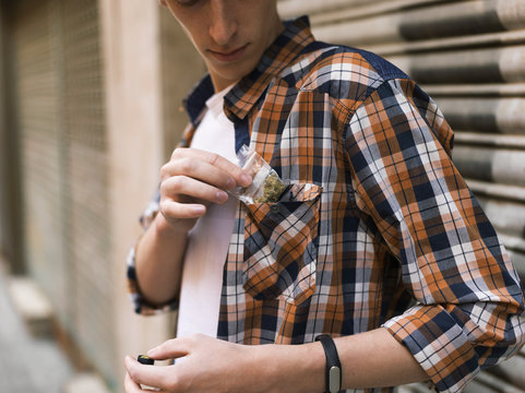 Man putting dope pack to pocket