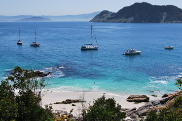 View of Nosa Senora Beach with boats at Cies Islands, Galicia, Spain