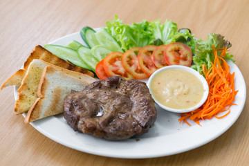 Fresh steak with salad on white for Serve customer,Food for the hungry people.
