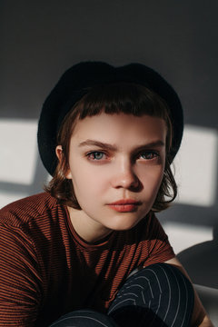 Surreal studio portrait of beautiful young woman with color lenses