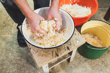 We prepare sauerkraut with our own hands