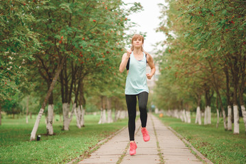 Fototapeta premium girl is engaged in sports exercises in nature