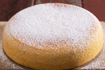 sponge cake on old wooden table.