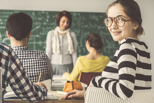 In Classroom With Students One Of Them Look Behind