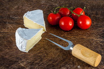 Closeup of brie cheese and cherry tomatoes