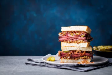 Wall murals Snack Roast beef sandwich on a plate with pickles. Copy space.