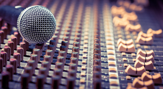 dynamic microphone on audio mixing board