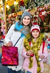 Female customers staring at counter of Christmas market