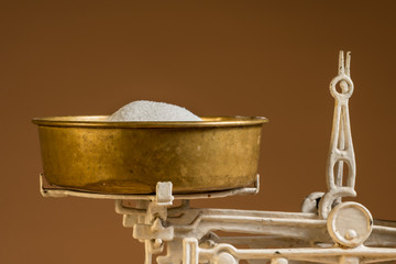 Old white vintage kitchen scale, brass with sugar