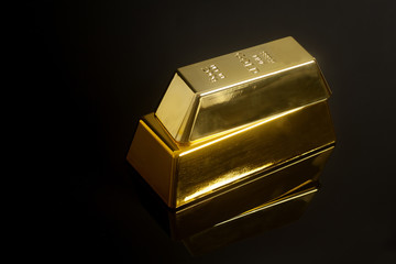 Gold bullion on black background