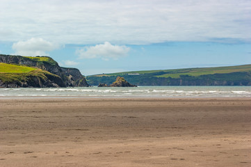 Landscape From Beach Showing Rocky Outcrop