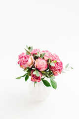 Obraz na płótnie Canvas Pink rose flowers bouquet on white background. Minimal festive flower concept.