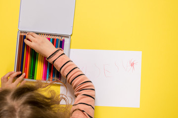 girl searching for a color pencil