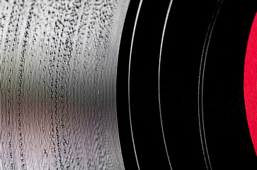 Vinyl record surface extreme close up with red label