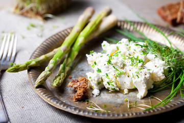 Roasted asparagus with cream cheese and fresh herbs spread.
