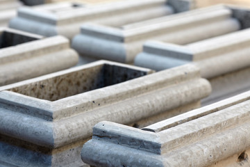 Cement tiles. Details from cement blocks for registration of various designs in construction.