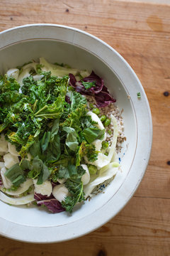 Sorgo bianco salad with chopped raw and cooked chicory, green asparagus, kale, fennel, fresh peas and artichokes seasoned with rocket pesto al pecorino.