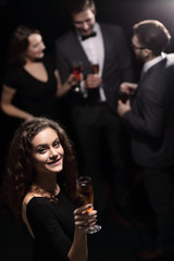 stylish young woman with glass of champagne