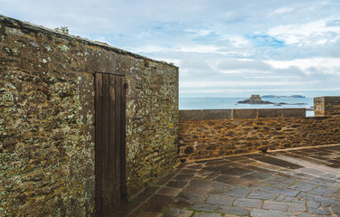 Fragment of top of ancient fortification ramparts facing the sea in Saint-Malo, Brittany, France