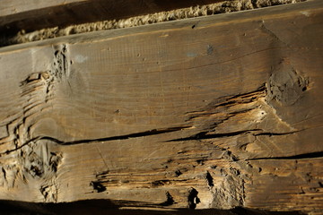 wooden beam. old house. a wall from a bar a fragment.