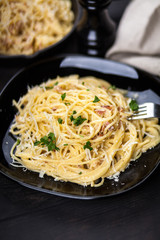 Spaghetti carbonara with egg and pancetta