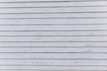 Texture backdrop background white greyish wooden wall from horizontal shabby narrow long boards with scuffs and spots