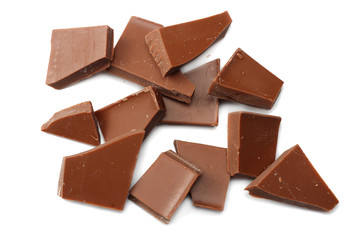 cracked chocolate candies sweets isolated on white background top view