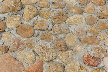Texture backdrop background stone pavement paving slab of gray, brown, orange, pastel colors from round, rectangular, triangular elements