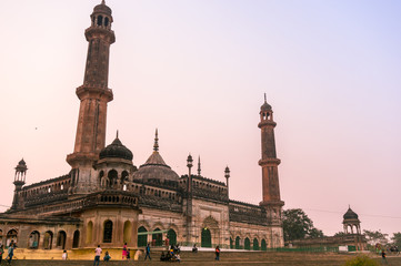 Fototapeta na wymiar Lucknow, India: 3rd Feb 2018: The entrance and gardens of the bara imambara. The spires and dome of the main building and the beautiful well maintained grounds make this a famous tourist spot.