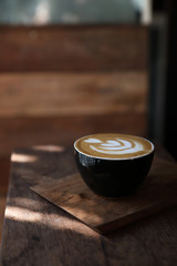 Cappuccino coffee break on wood background