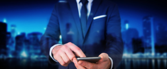 Businessman using modern mobile phone