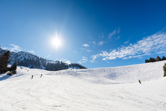 Ski slope on sunny winter day
