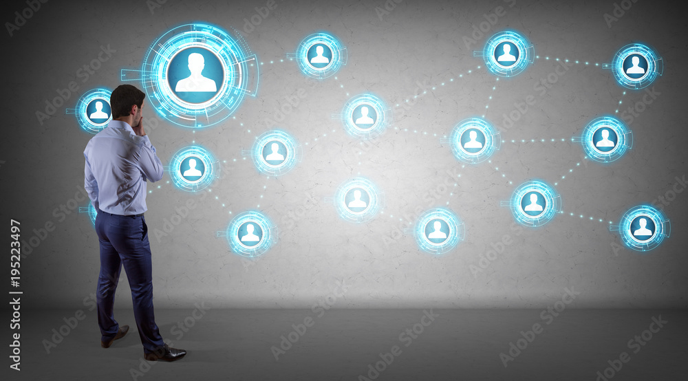 Poster Businessman using social network interface on a wall 3D rendering