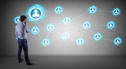 Businessman using social network interface on a wall 3D rendering