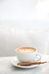 cappuccino or Latte art coffee made from milk on the white table in coffee shop