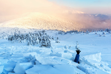 A man covered with a snow avalanche stretches out his hand to help. Danger extreme concept