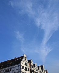 Fototapeta na wymiar White shields of historic buildings in Gdansk.