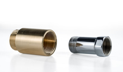 Brass and chrome plated pipes with external and internal thread. Isolated on white.