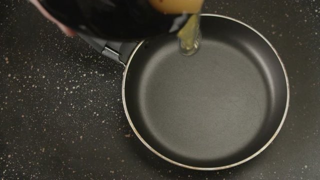 Fried eggs in a pan in the form of a heart